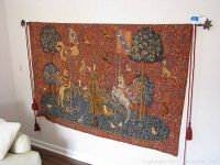 Full front view of tapestry on wall showing entire scene