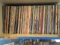 Top shelf full of vinyl LP albums stored vertically