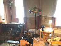 Overall view showing two assembled lamps and two detached shades on bench