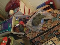 Overall view showing sewing wood box, watercolor set, yarn bundles on tapestry case and red plush box in background