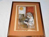 Framed mixed media artwork titled 'Bird's Nest' showing a girl holding a nest, with warm earth tones, abstract background and signature visible