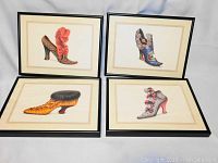 Four framed Victorian style shoe prints displayed together, showing their overall condition and appearance.