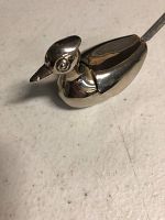 Close-up view of the duck-shaped salt cellar showing detailed head and smooth body.