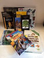 Photo showing ten books covering topics such as birding, wildlife, trees, and Colorado, arranged to display front covers and titles.
