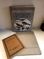 Three bird books displayed showing covers: 'The Birds of America' by John James Audubon, 'Audubon' with birds of America embossed cover, and 'The Book of Birds' National Geographic Society.
