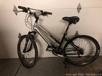 Full view of the Trek Navigator 500 bicycle showing silver frame, black tires, and seat