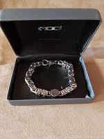 Harley Davidson chain bracelet in original black box with bracelet laid inside, showing clasp and logo.