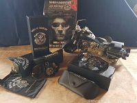 Shows lot contents including metal motorcycle, sunglasses with case and pouch, and Jax Banner in packaging.