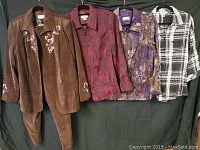 Full view of the lot showing four tops/jackets and a matching brown corduroy pant suit with floral embroidery