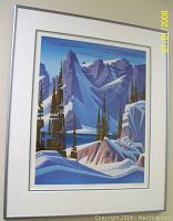 Frontal photo of the framed limited edition print showing the overall size, matting and silver frame.