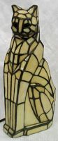 Front view of beige and brown cat stained glass lamp, unlit, showing geometric design.