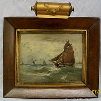 Frontal view of entire framed painting with picture light attached