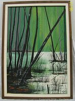 Full view of original oil painting on board by W T Carlsen showing marsh scene with trees and water under green sky.