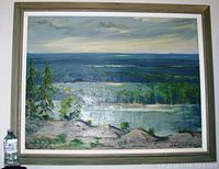 Framed oil painting landscape showing overall view with signature visible
