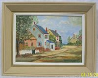 Framed oil painting on board showing houses in a rural landscape, signed Florence Johns, with beige frame.
