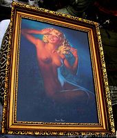 Front view showing nude pin-up framed print with ornate gilt wood frame and signature at bottom center of print.