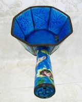Top view showing the octagonal interior walls embossed with floral patterns and deep turquoise blue enamel.