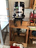 Full front-left view of motor mounted on wooden stand
