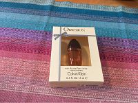Photo of a new Calvin Klein Obsession Eau de Parfum spray box with 15 ml bottle inside.