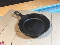 Top view of the Lodge cast iron skillet showing cooking surface and handle