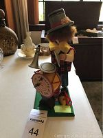 Front view of Steinbach music box clown figurine showing the outfit and drum details.