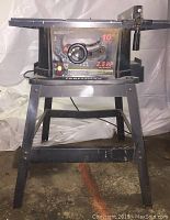 Front view of Craftsman 10 inch table saw on metal stand, showing 2.5 HP motor label and controls.