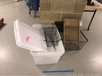 Two white plastic storage bins with lids, medium and large size
