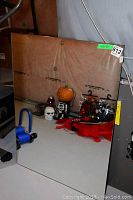 Photo of a rectangular mirror with visible reflection of objects and background, showing condition and size.