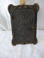 Front view of the letter slot showing raised floral Art Nouveau design and decorative corners
