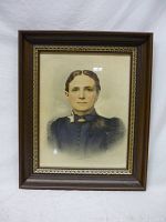 Full view of antique framed portrait of a lady, showing the wooden frame with decorative gold inner trim.