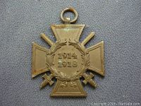 Front view of the WWI German Hindenburg Cross medal showing laurel wreath and swords with 1914-1918 date.