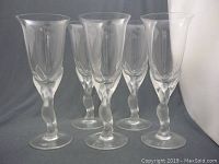 Full view of the set of five clear wine glasses with twisted stems, showing overall shape and size.
