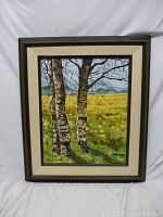 Framed oil painting with birch trees in a meadow, full view of frame and liner
