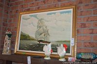 Framed oil painting showing large sailing ship on the water with cliffs in background, signed by D. Fairweather, with visible damage.