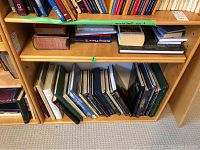 Shelf with multiple reference books including art and design topics
