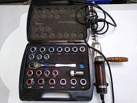 Photo of Armstrong socket set in black plastic case, showing 26 sockets, ratchet handle, and an extender. Next to it is the vintage electric hedge trimmer with wooden handle and power cord coiled.