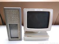 Front view of Tandem CRT display monitor and keypad terminal showing screen, bezel, and keypad with function buttons.