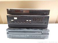 Photo of the three vintage audio components stacked: JVC tuner on top, PA amplifier in the middle, and Pioneer CD player at the bottom.