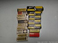 Collection of 15 vintage electronic vacuum tubes in original boxes from multiple brands arranged on a flat surface.