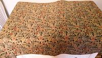 Full view of the tapestry laid out flat showing the floral foliage pattern and overall size.