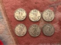Six Walking Liberty half dollar coins front side showing Lady Liberty walking design and mint dates