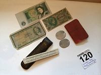 Photo showing all items together including address book, dog tags, currency notes, and slide rule with case.