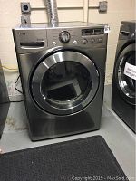 Front view of LG stainless steel dryer showing control panel