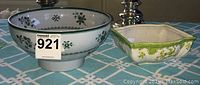 Spode Gloucester bowl and decorative ceramic bowl side by side on table with MaxSold tag number 921