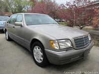 Front three-quarter view showing exterior condition and bumper damage