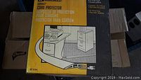 Boxed new old stock cord protector, yellow and black packaging, showing the brand Wiremold and product details.
