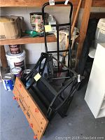 Overall view of the Workmate 300 workbench, hand truck dolly, and shovel in a garage setting.