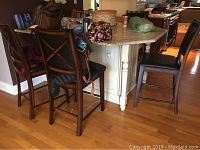 Three stools placed at kitchen island showing front and side profiles