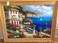 Full view of oil painting in gold ornate wood frame, angled slightly.