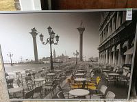 Full front view of Saint Marks Square framed print showing outdoor cafe, lamp posts, and waterfront.